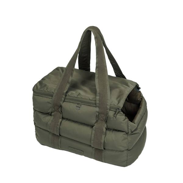 Green duffel bag with handles on a light gray background