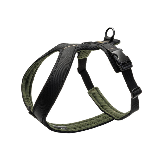 Green and black dog harness on a light gray background