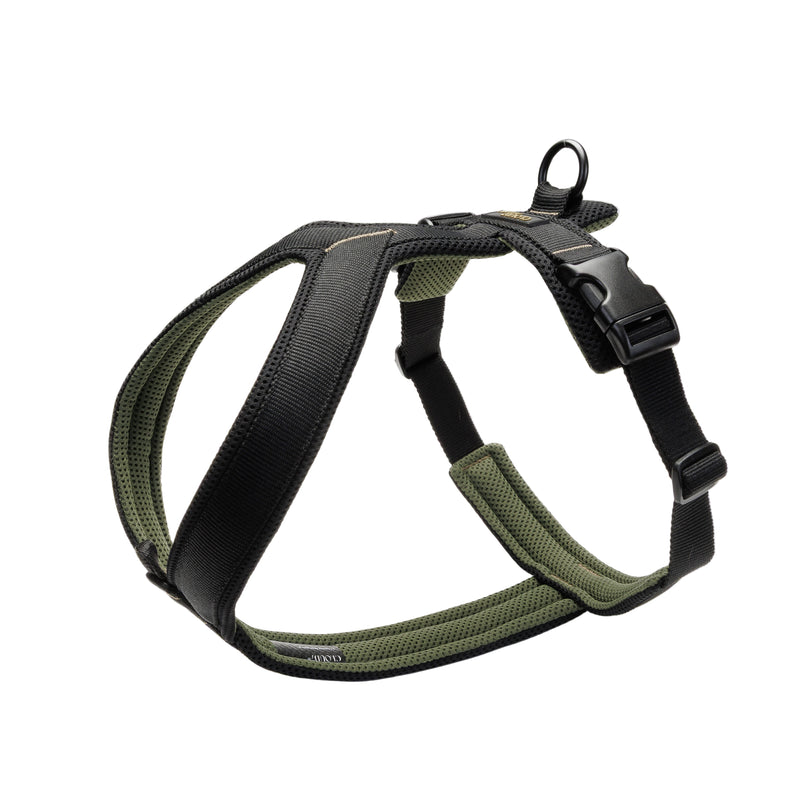 Green and black dog harness on a light gray background