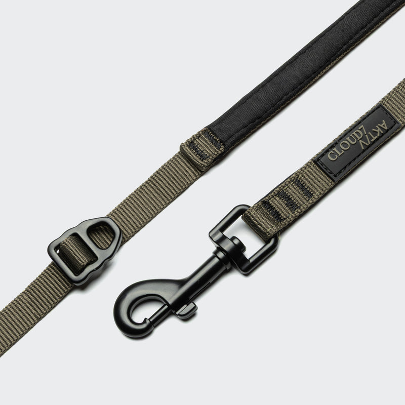 Dog leash with black and brown design on a light gray background