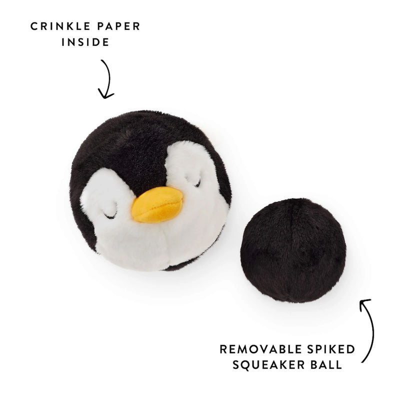 Penguin-shaped toy with crinkle paper inside and removable spiked squeaker ball on a white background