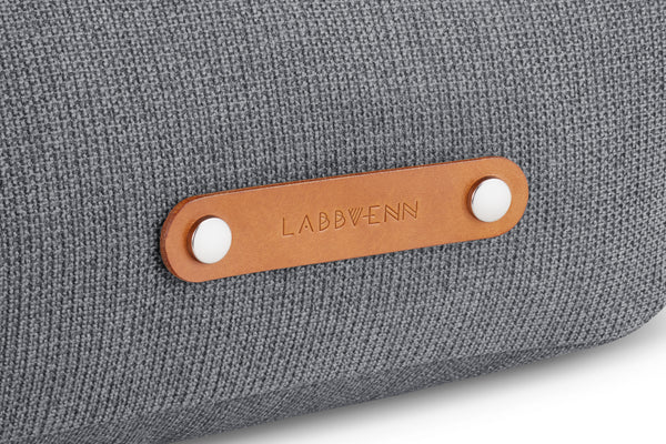 Gray bag with a brown leather label featuring 'LABBVENN' on a white background