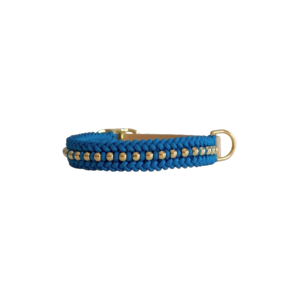 Blue braided dog collar with gold accents on a white background